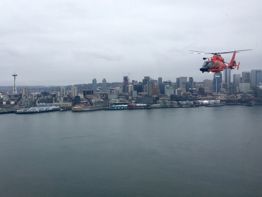 Port Angeles-based Coast Guardsmen fly over Seattle Seahawks game