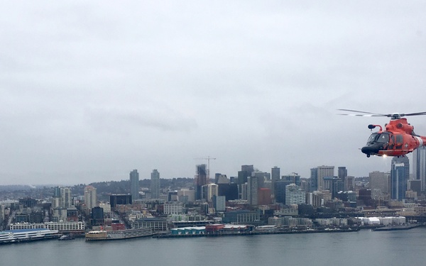 Port Angeles-based Coast Guardsmen fly over Seattle Seahawks game