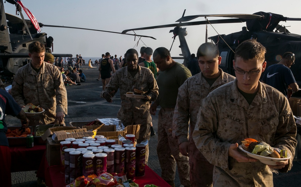 Marines and Sailors relax during a Steel Picnic event in the Red Sea