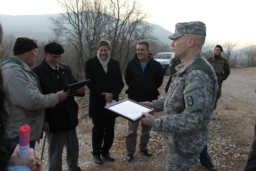 KFOR hands Camp Cabra land back to local landowners outside Zubin-Potok