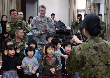 Of big boots and bigger hearts: American, Japanese service members share holiday cheer at Holy Family Home