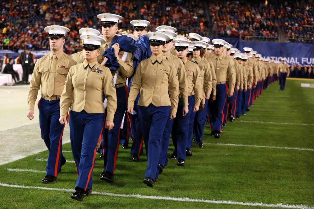 Marines stand together to unfurl Old Glory at 38th annual Holiday Bowl