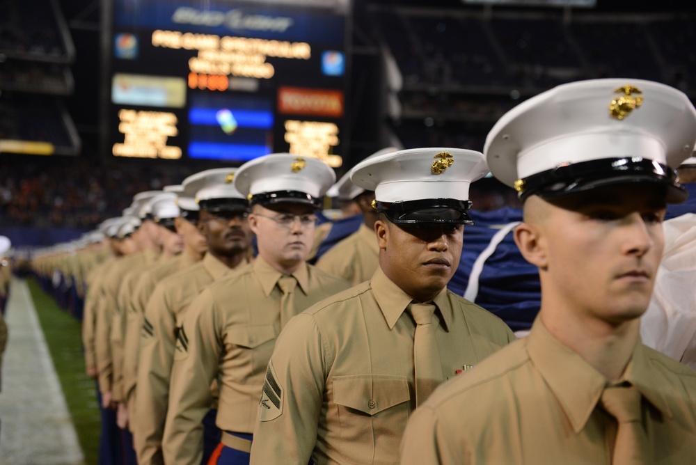 Marines stand together to unfurl Old Glory at 38th annual Holiday Bowl