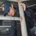 USS Ronald Reagan sailor performs deck preservation
