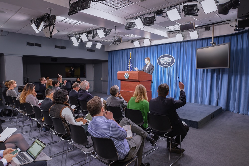 Pentagon Press Secretary Peter Cook conducts a press briefing with reporters at the Pentagon