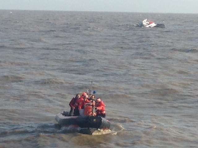 Coast Guard rescues 2 from capsized tug boat