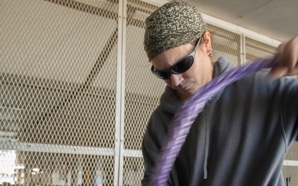 Sailors maintain mooring line aboard USNS Spearhead