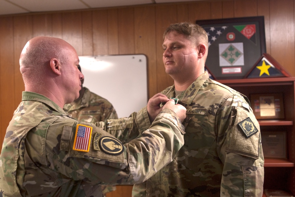 Commander presents awards to Soldiers at the 102nd Public Affairs Detachment