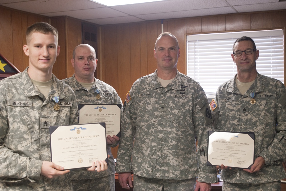 Brigadier general presents awards to Soldiers at the 102nd Public Affairs Detachment