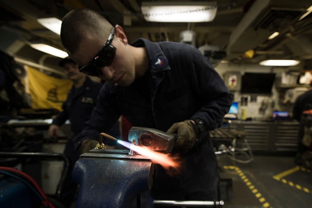 USS Gonzalez sailor performs maintenance