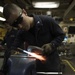 USS Gonzalez sailor performs maintenance