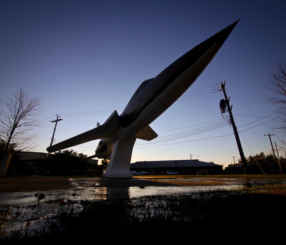 Static display aircraft at sunrise