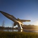 Static display aircraft at sunrise