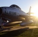 Static display aircraft at sunrise