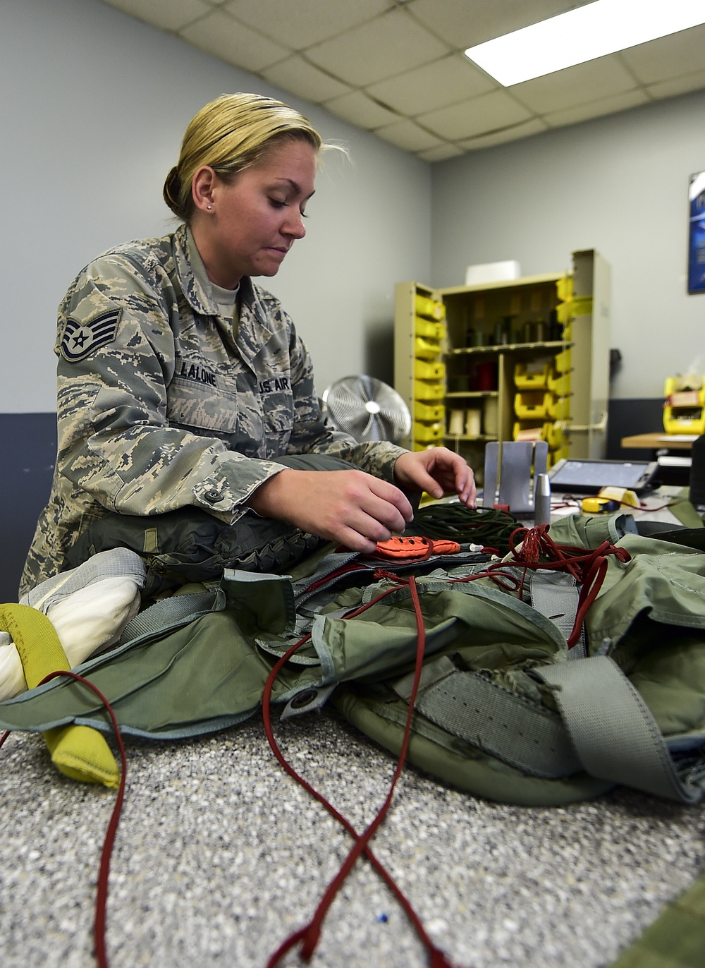 Aircrew flight equipment Airmen pack parachutes