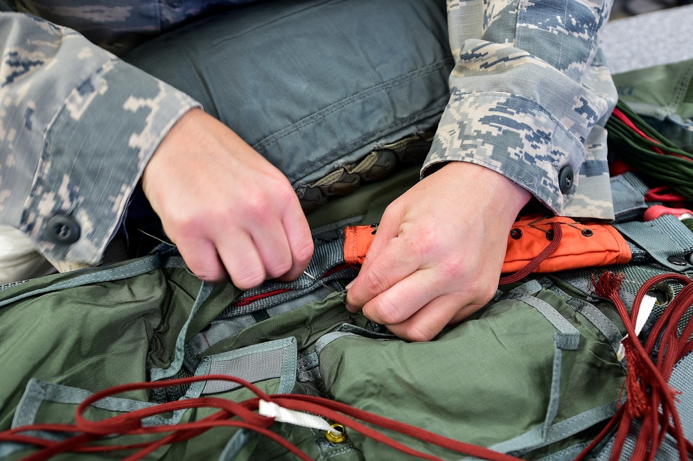 Aircrew flight equipment Airmen pack parachutes