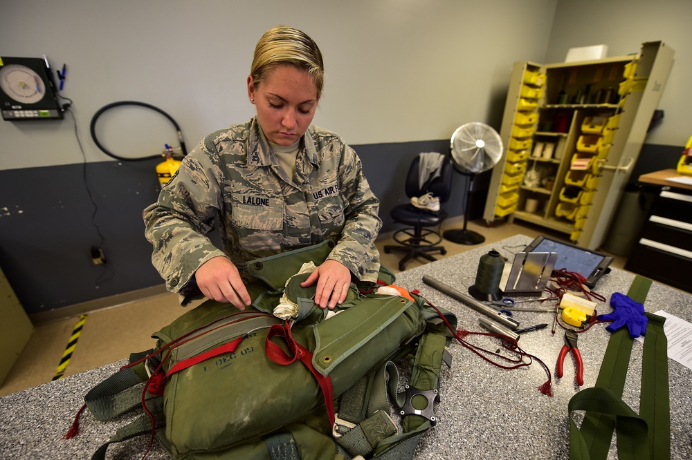 Aircrew flight equipment Airmen pack parachutes