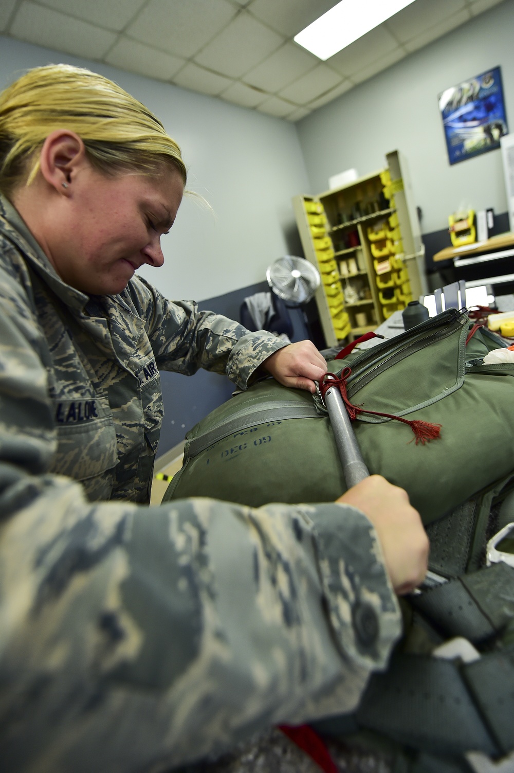 Aircrew flight equipment Airmen pack parachutes