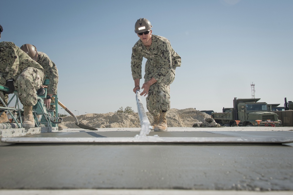 Navy Seabees build concrete pad in Bahrain