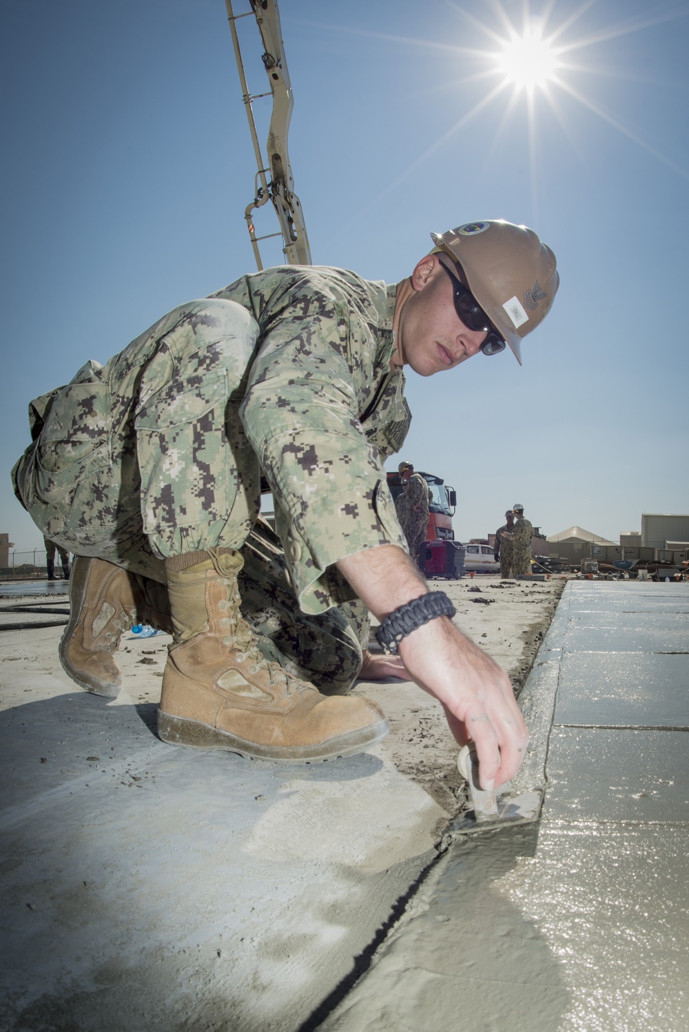 Navy Seabees build concrete pad in Bahrain