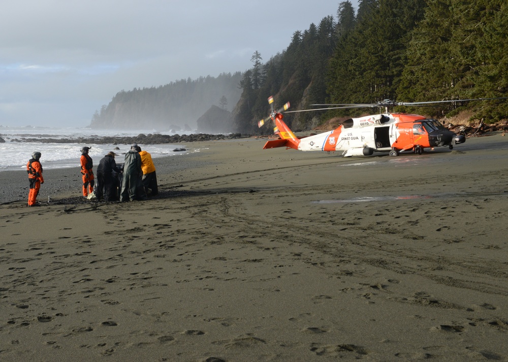 The Coast Guard helps remove trash from a beach near Neah Bay, Wash.