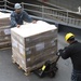 USS Germantown sailors load supplies