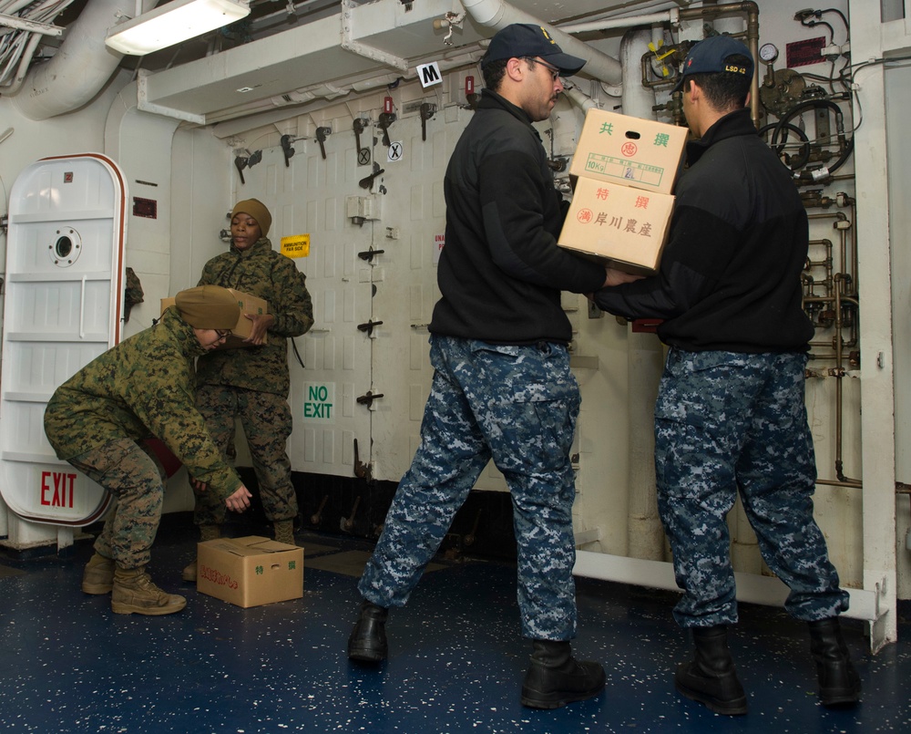 USS Germantown sailors and Marines load supplies