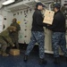 USS Germantown sailors and Marines load supplies