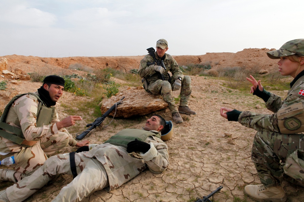 Coalition trainers provide Iraqi army squad movement, medical training