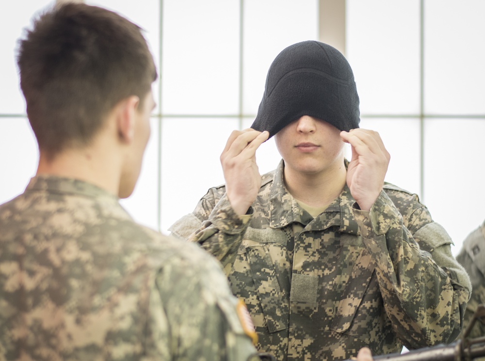 Female cadet blindfolded for 5-meter drop