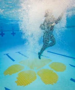 Female US Army ROTC cadet underwater
