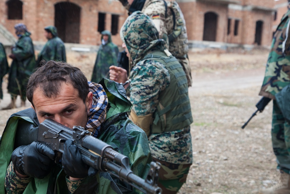 Peshmerga soldiers conduct urban patrol training