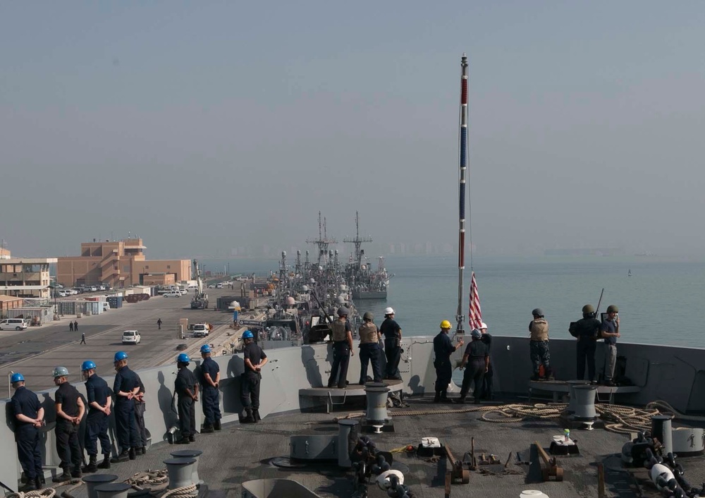 Marines and Sailors aboard the USS Arlington conduct maintenance in Bahrain