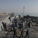 Marines and Sailors aboard the USS Arlington conduct maintenance in Bahrain