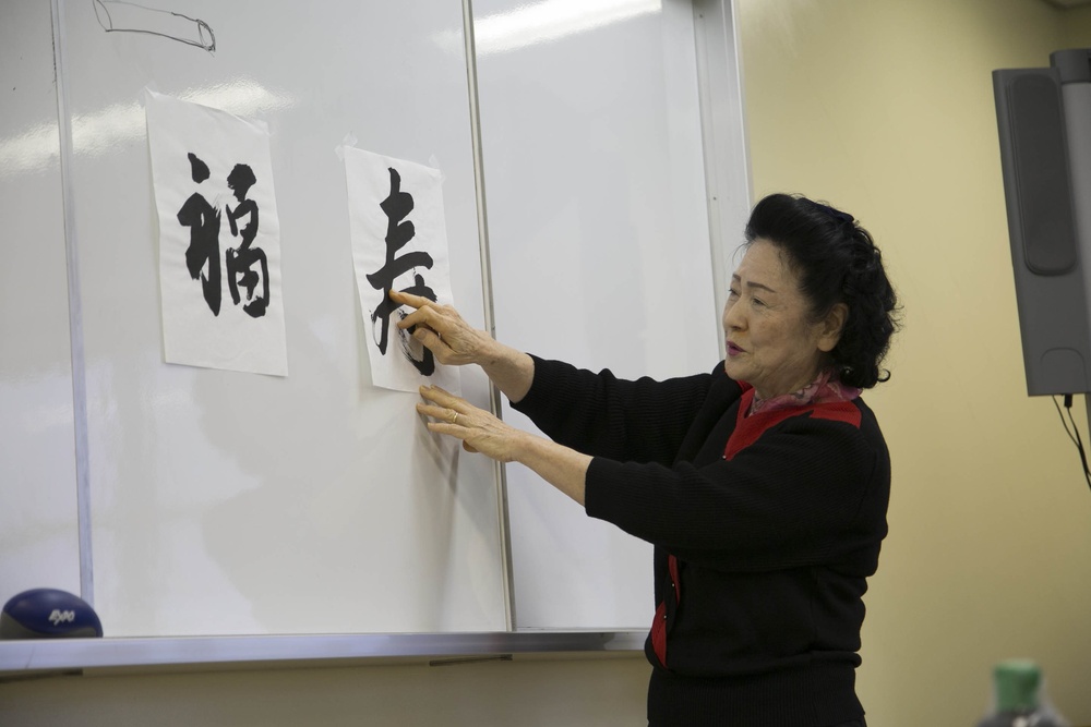 Status of Forces Agreement Personnel learn to write Japanese calligraphy