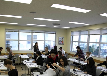 Status of Forces Agreement Personnel learn to write Japanese calligraphy