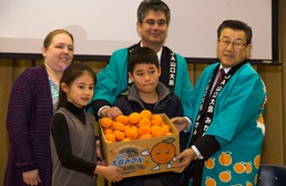 Local farmers present mikans to M.C. Perry