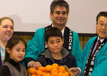 Local farmers present mikans to M.C. Perry