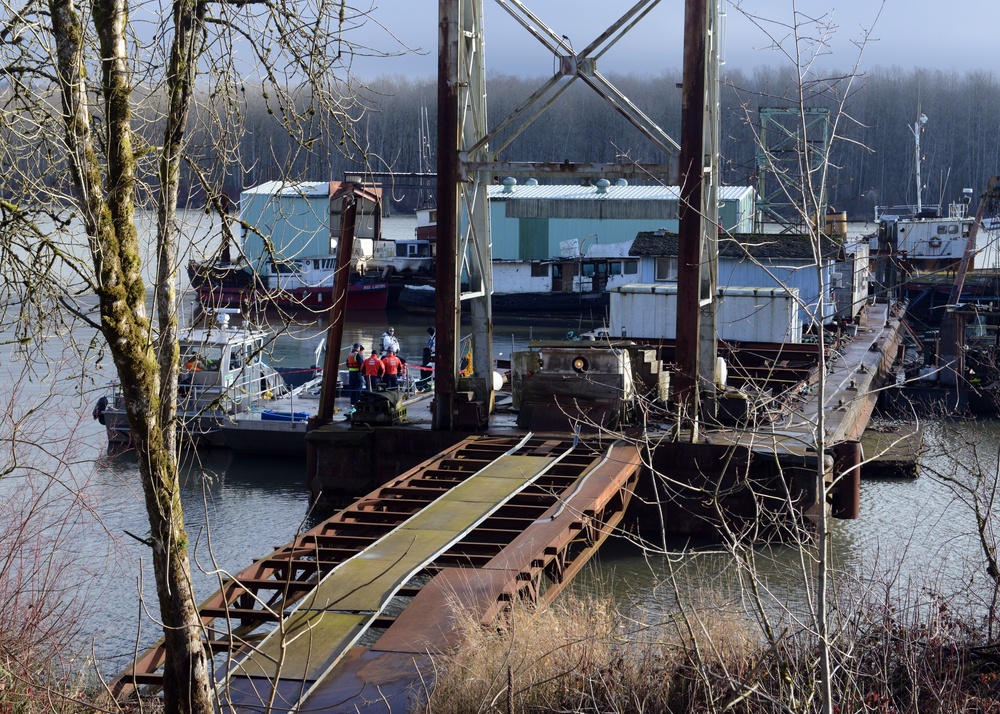 Coast Guard oversees HAZMAT removal from barge on Columbia River