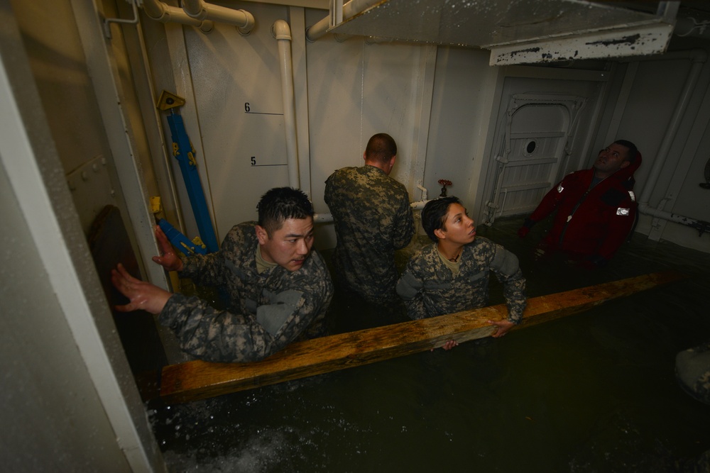 Watercraft operator students battle raging water