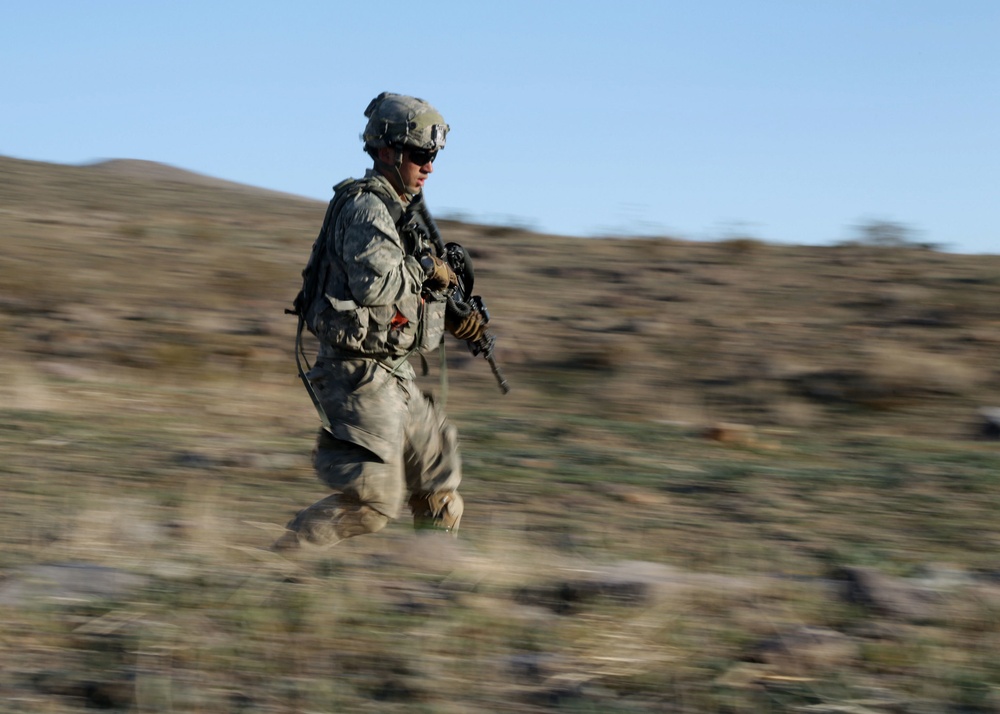 US Soldier runs during live fire