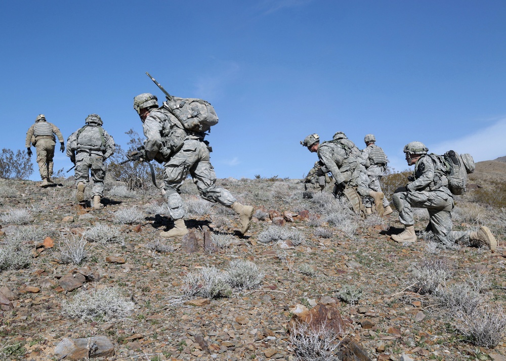 US Soldiers run to objective