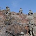 US Soldiers climb hill