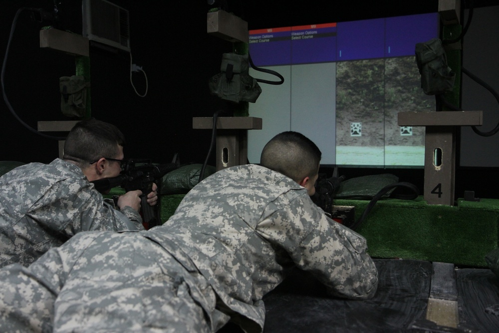 Soldiers use weapons simulator to hone skills in Kosovo
