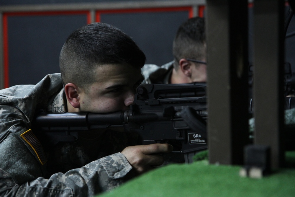 Soldiers use weapons simulator to hone skills in Kosovo
