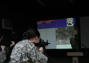 Soldiers use weapons simulator to hone skills in Kosovo