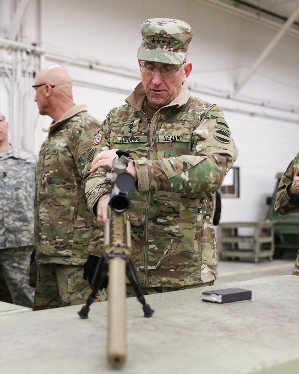 Gen. Robert Abrams, FORSCOM commander, handling an M110 Semi-Automatic Sniper System at Iowa National Guard's Sustainment Training Center