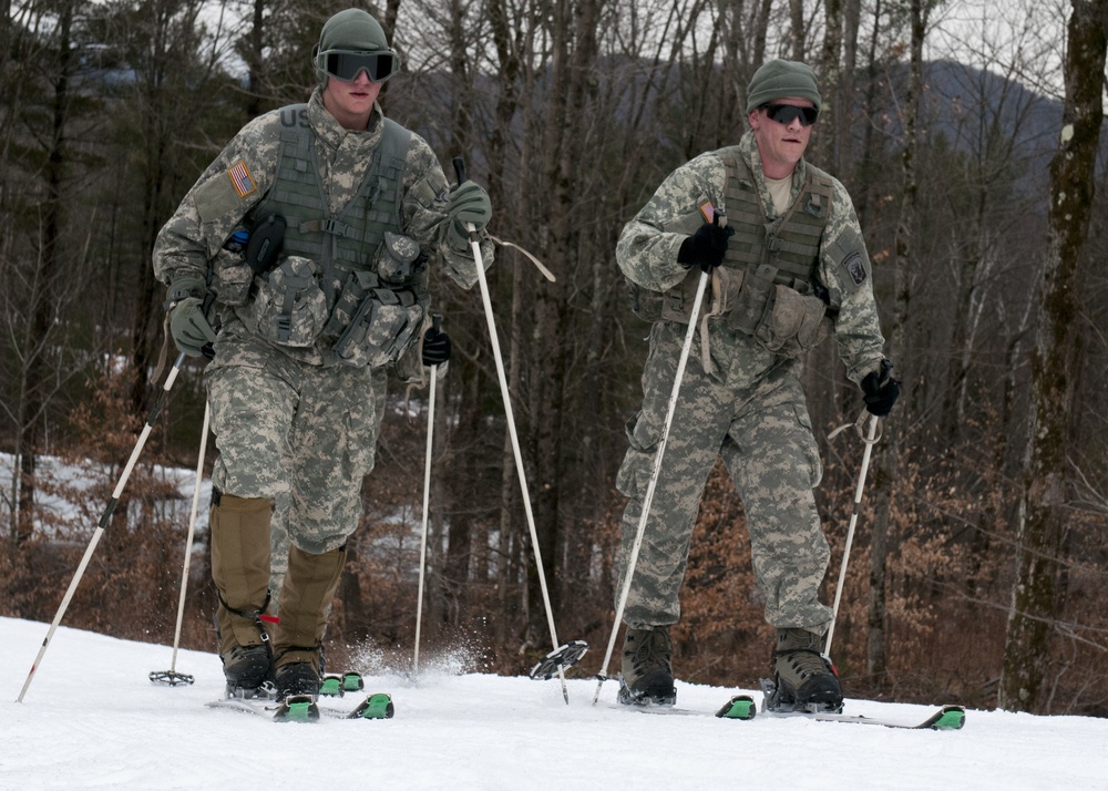 Soldiers ski together as  fireteam during biathlon training