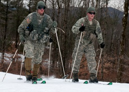 Soldiers ski together as  fireteam during biathlon training