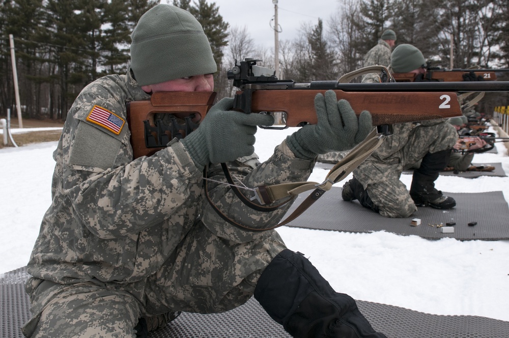 A Soldier fires a .22-caliber rifle during a biathlon exercise